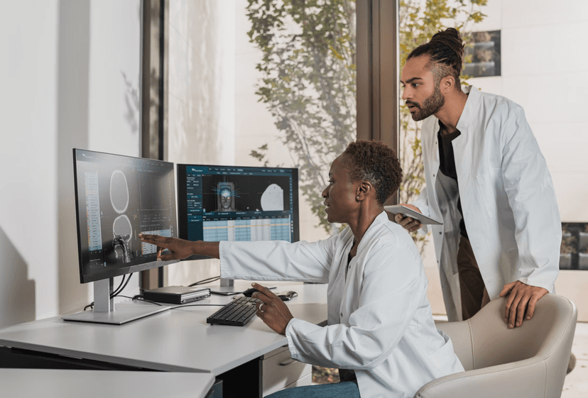 Doctors collaborating and reviewing medical imaging